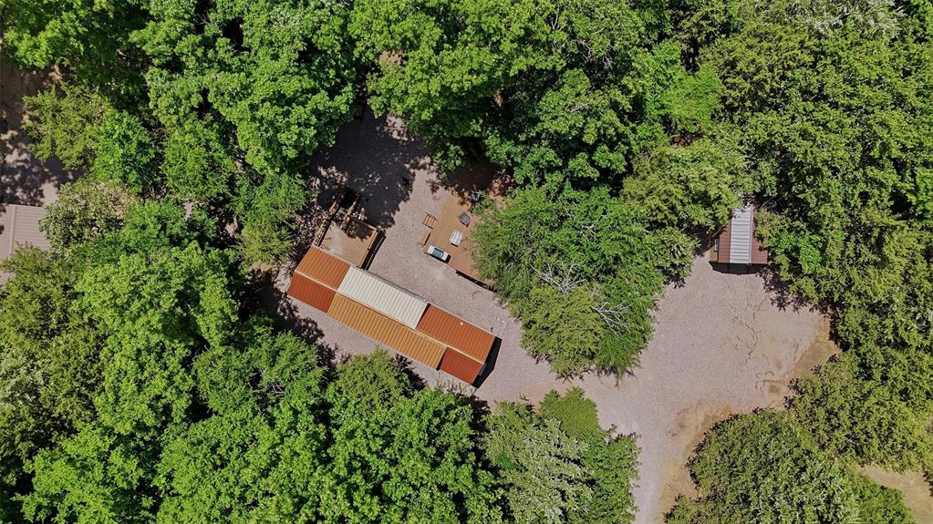 3958 Ranch Road Whitesboro, TX 76273 - Photo 39 of 40 Aerial perspective showcasing a property surrounded by mature trees