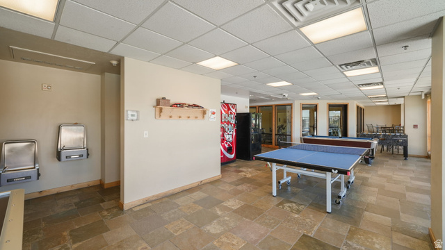 1364 Still Water Drive, Unit R2012 Heber City, UT 84032 - Photo 25 of 30 Recreation room featuring stone tile flooring, a suspended ceiling with recessed lighting, and a table tennis setup