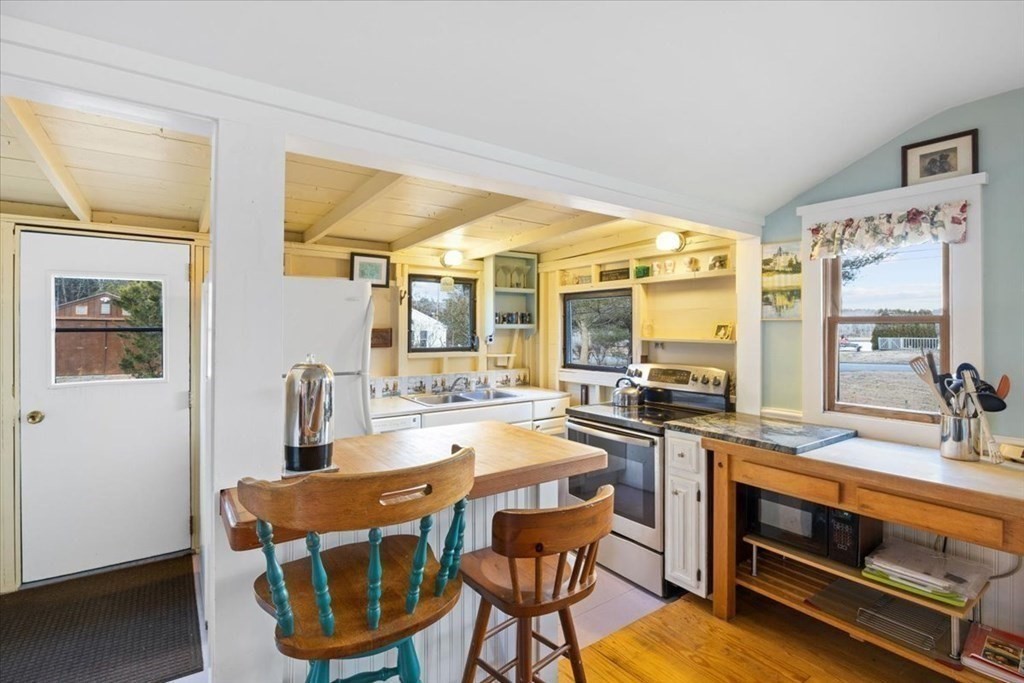 2 Helminth Avenue Wareham, MA 02571 - Photo 11 of 38 a dining hall with stainless steel appliances granite countertop a stove and a refrigerator