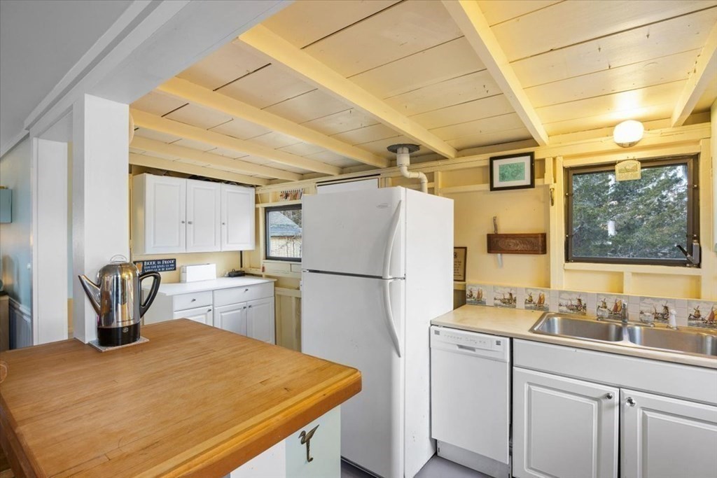 2 Helminth Avenue Wareham, MA 02571 - Photo 12 of 38 a kitchen with a refrigerator and a sink