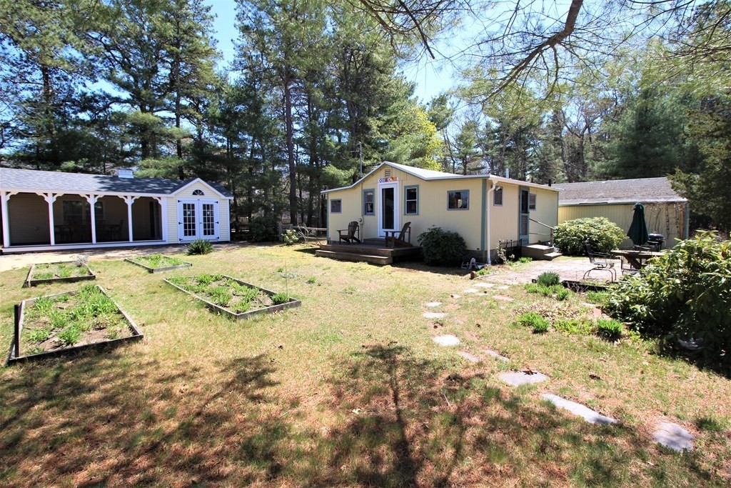 2 Helminth Avenue Wareham, MA 02571 - Photo 22 of 38 a view of a house with a yard covered in snow