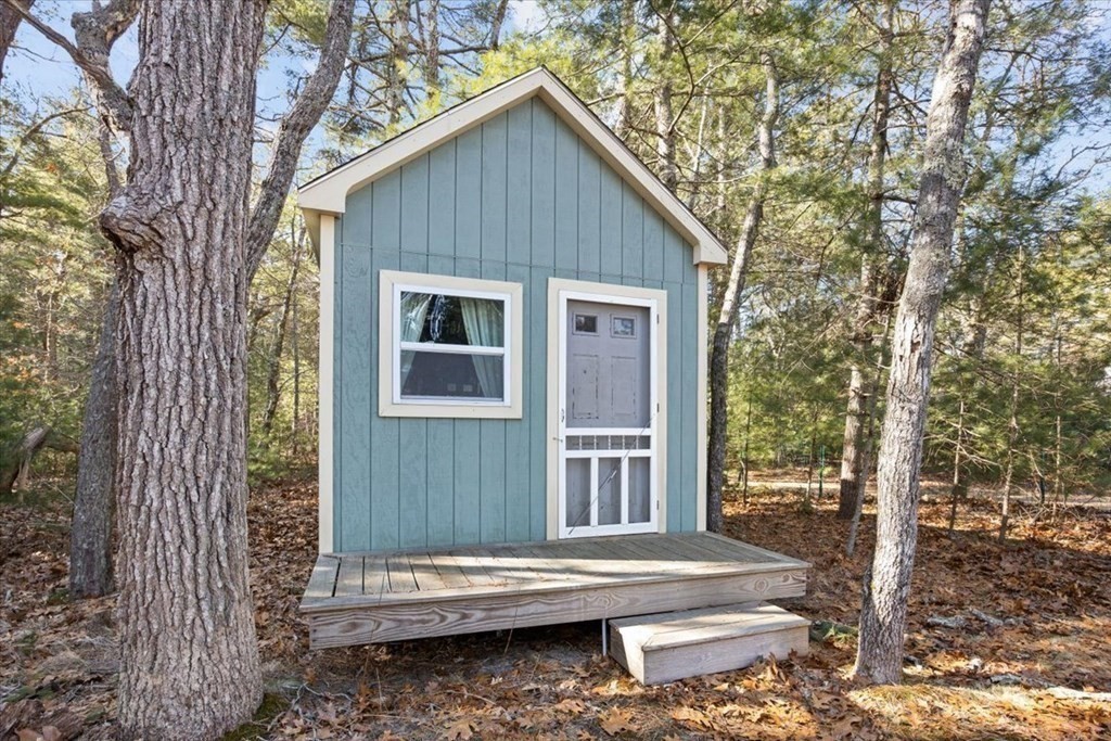 2 Helminth Avenue Wareham, MA 02571 - Photo 29 of 38 a backyard of a house with fountain table and chairs