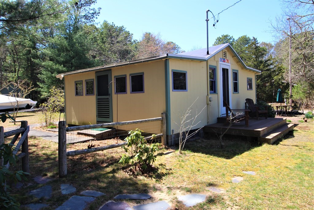 2 Helminth Avenue Wareham, MA 02571 - Photo 6 of 38 a front view of a house with a yard covered with snow