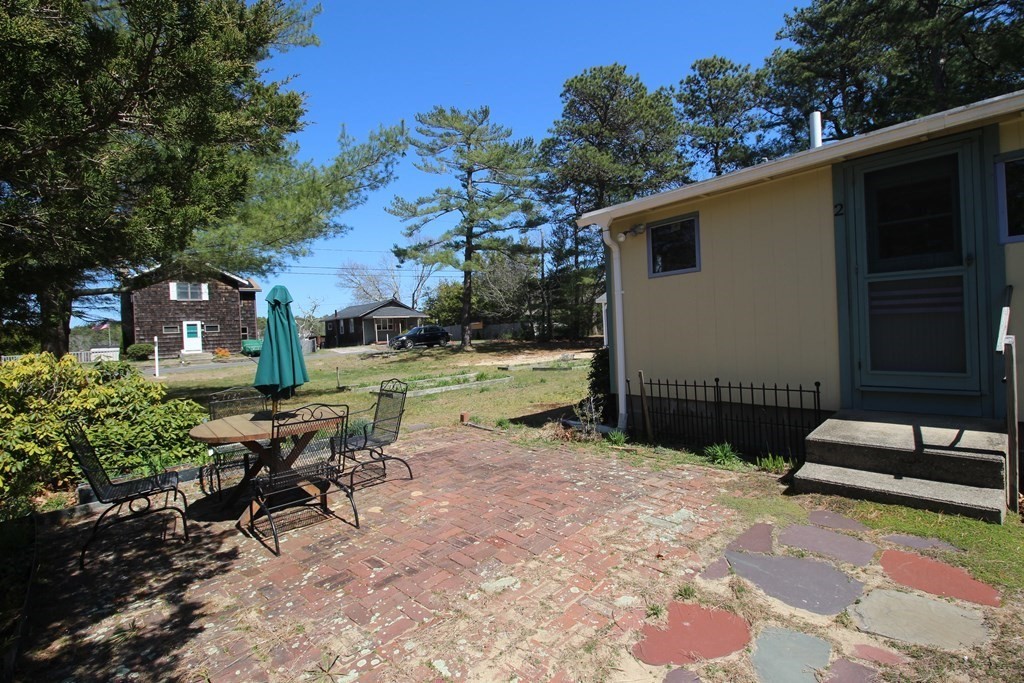 2 Helminth Avenue Wareham, MA 02571 - Photo 7 of 38 a view of backyard with outdoor seating and green space