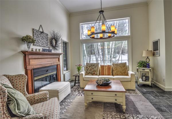 28 Belvedere Road Boxford, MA 01921 - Photo 8 of 19 a living room with furniture a flat screen tv and a large window