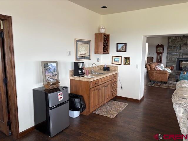 15736 2600th Road Cedaredge, CO 81413 - Photo 19 of 42 a room with furniture a flat screen tv and a fireplace