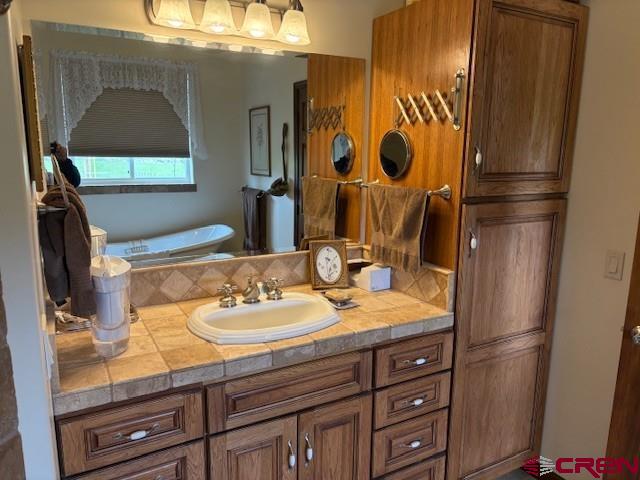 15736 2600th Road Cedaredge, CO 81413 - Photo 24 of 42 a bathroom with a sink and a mirror