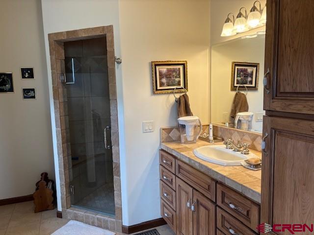 15736 2600th Road Cedaredge, CO 81413 - Photo 25 of 42 a bathroom with a sink and a mirror
