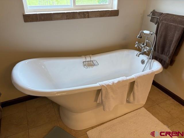 15736 2600th Road Cedaredge, CO 81413 - Photo 26 of 42 a view of a bathtub in a bathroom