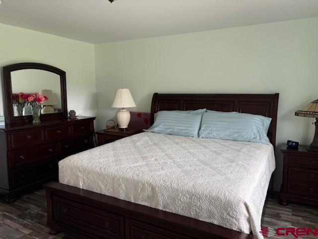 15736 2600th Road Cedaredge, CO 81413 - Photo 28 of 42 a bedroom with a bed and a dresser