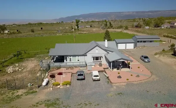 an aerial view of a house with outdoor space