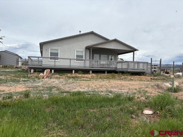 15736 2600th Road Cedaredge, CO 81413 - Photo 42 of 42 a front view of a house with a yard