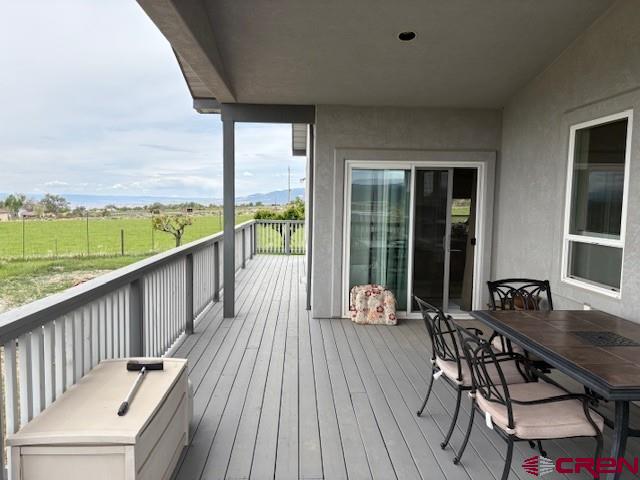 15736 2600th Road Cedaredge, CO 81413 - Photo 6 of 42 a view of balcony with wooden floor and outdoor seating