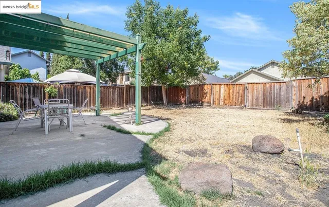 a view of a backyard with a patio