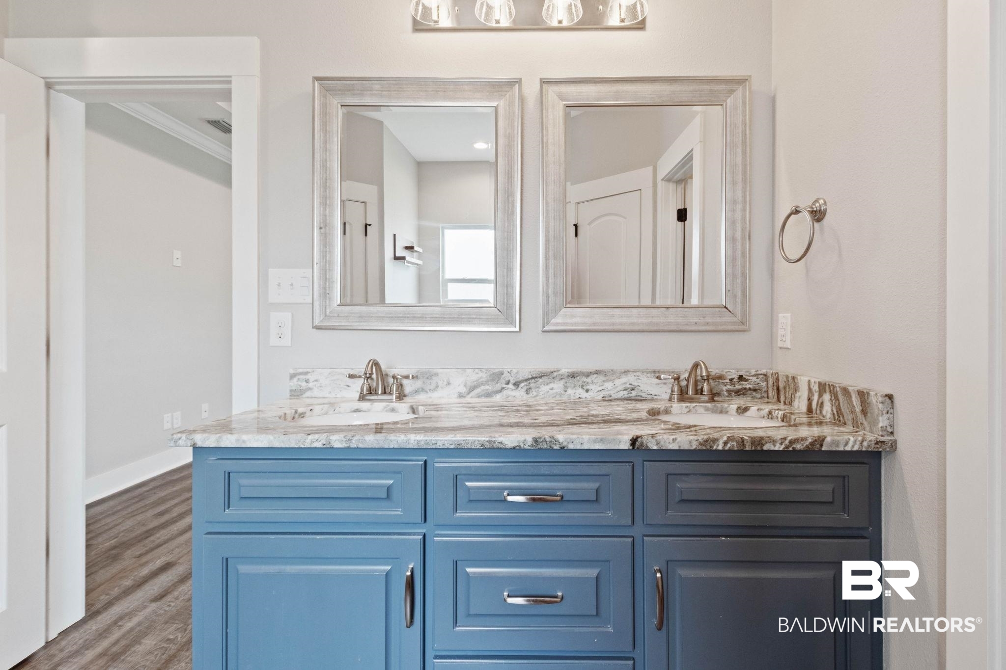 17376 Bankhead Boulevard Fairhope, AL 36532 - Photo 39 of 73 Full bathroom with double vanity and wood finished floors