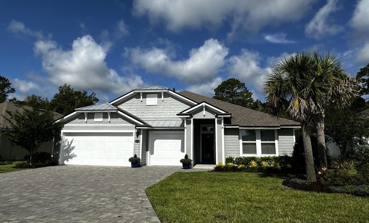 front view of a house with a yard