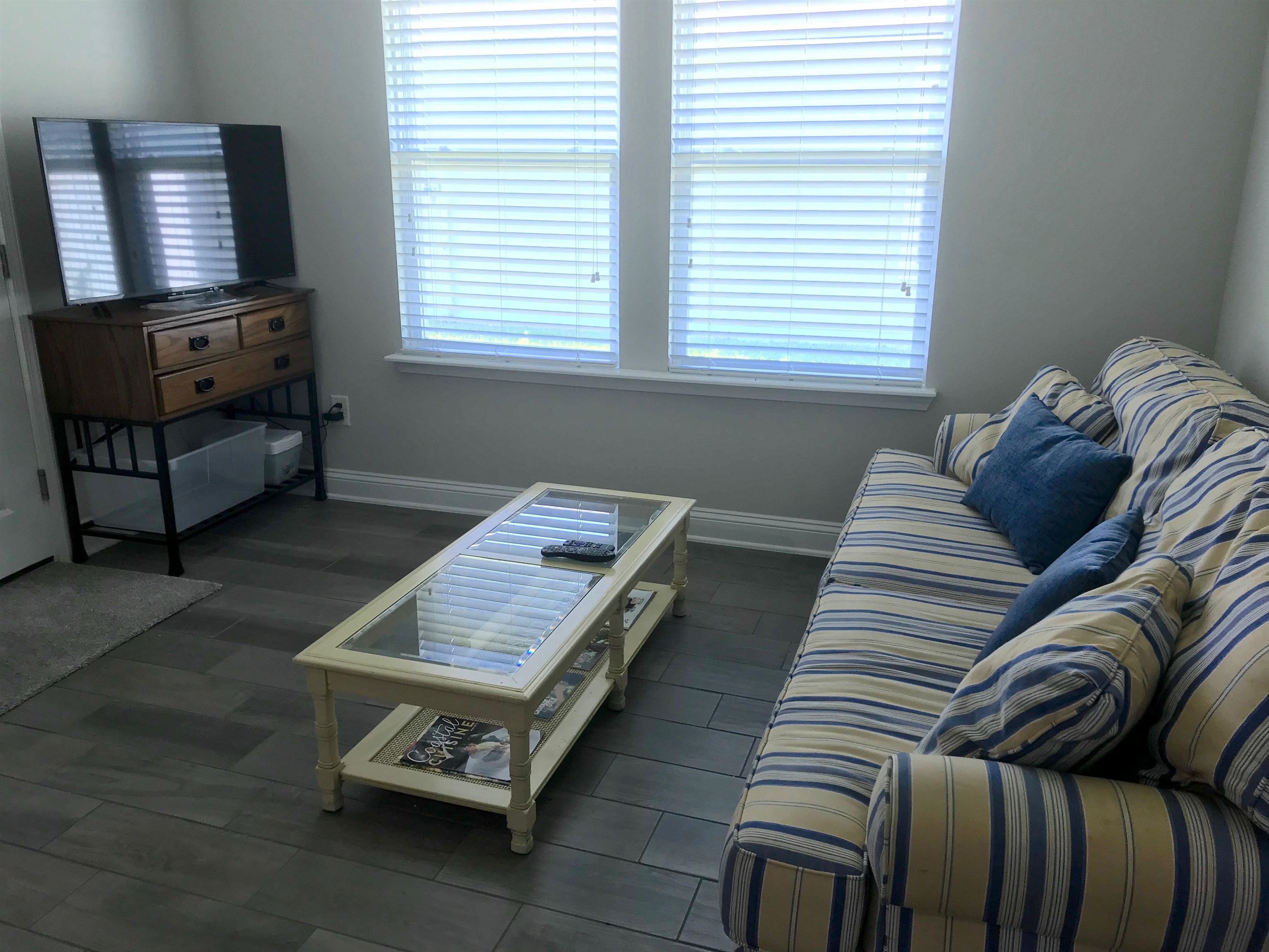 116 Coastal Hammock Way St. Augustine, FL 32086 - Photo 4 of 13 a living room with furniture and a window