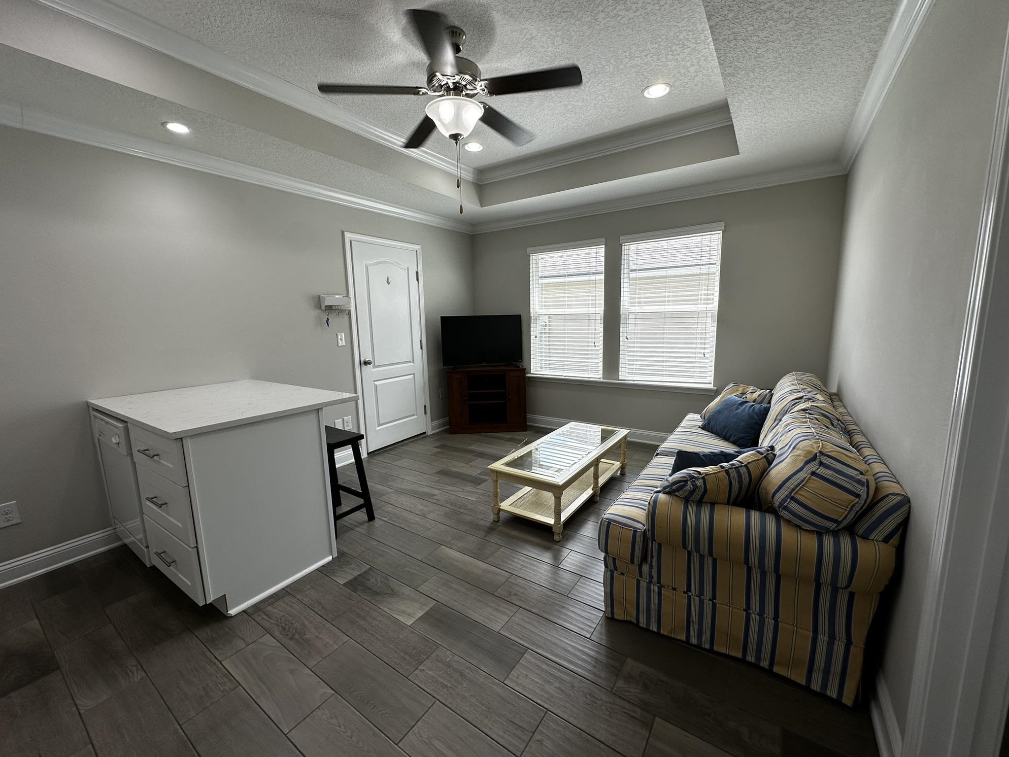 116 Coastal Hammock Way St. Augustine, FL 32086 - Photo 5 of 13 a living room with furniture and a flat screen tv