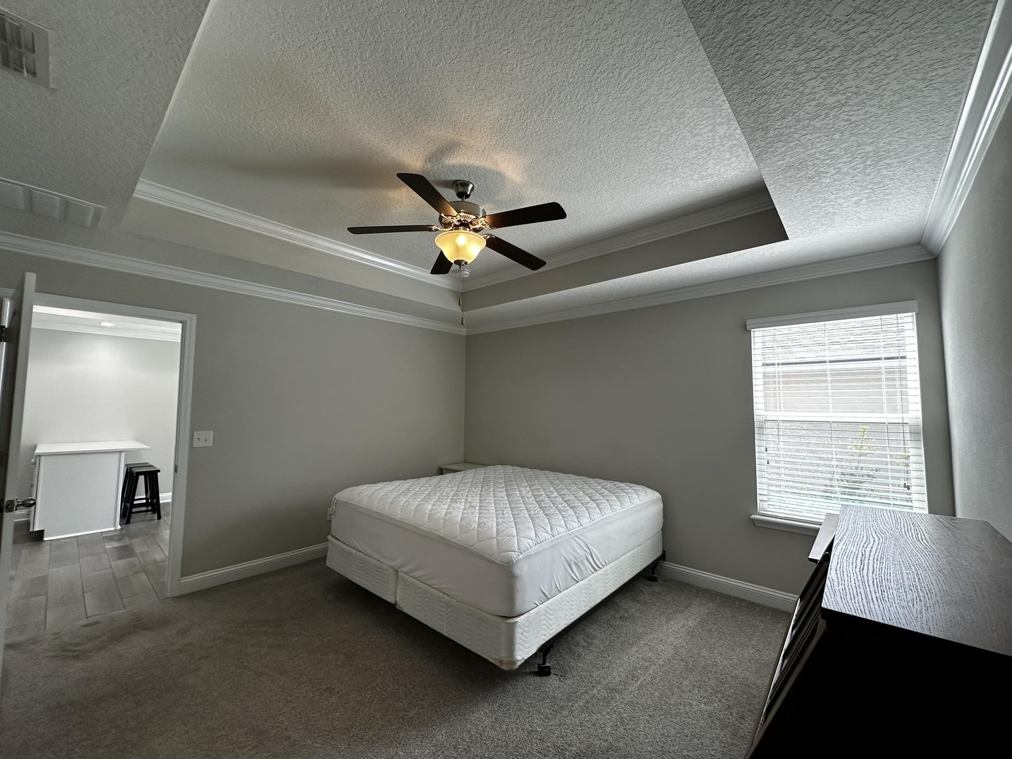 116 Coastal Hammock Way St. Augustine, FL 32086 - Photo 8 of 13 a bed sitting in a bedroom next to a window