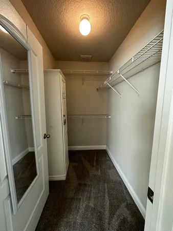 a view of an empty walk in closet