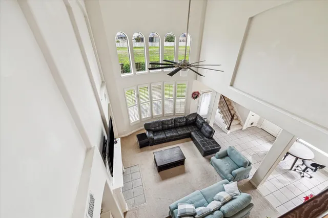 a view of living room with furniture and rug
