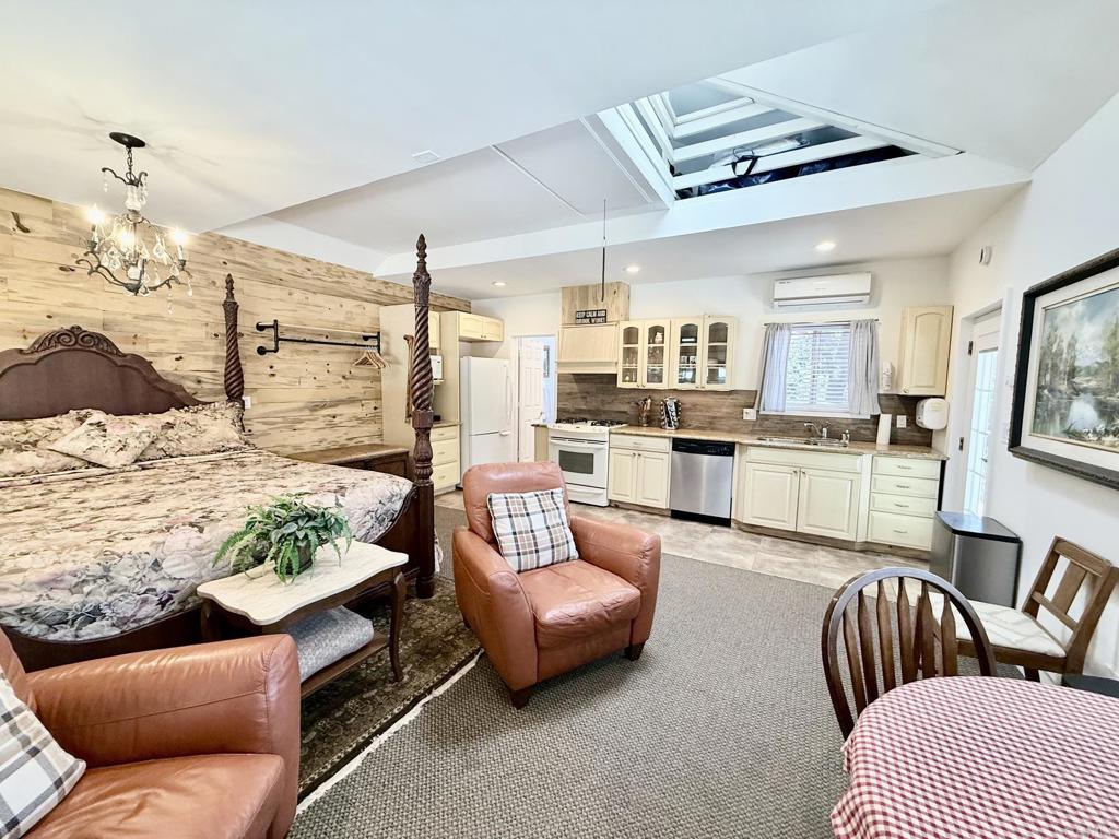 22292 Crestline Road Palomar Mountain, CA 92060 - Photo 28 of 38 a living room with furniture and a kitchen view