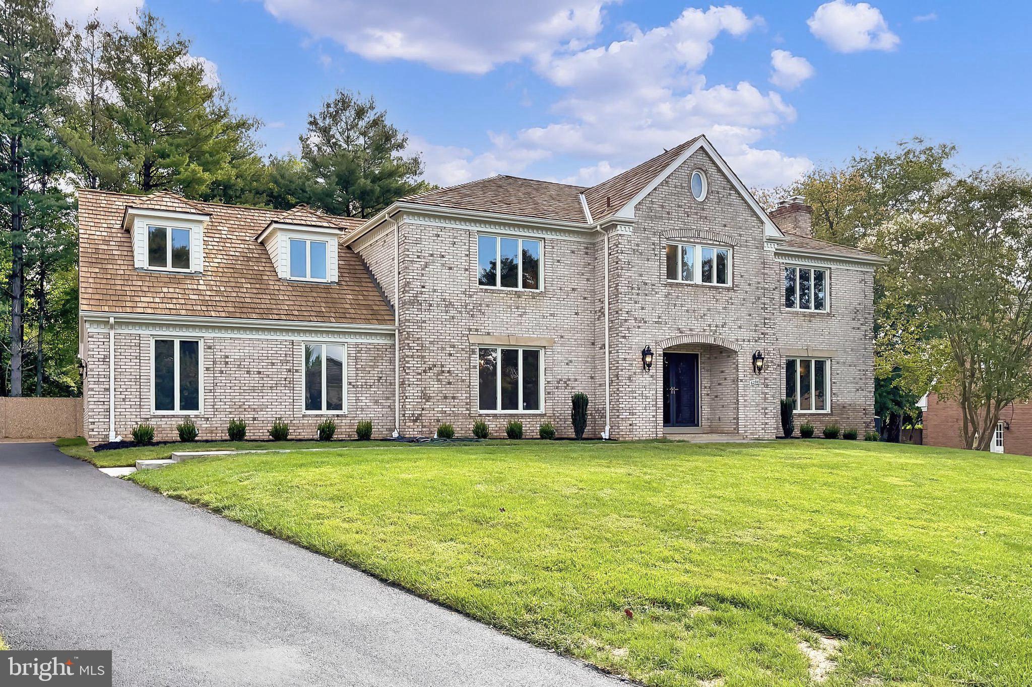 6294 Dunaway Court McLean, VA 22101 - Photo 1 of 76 a front view of a house with a yard
