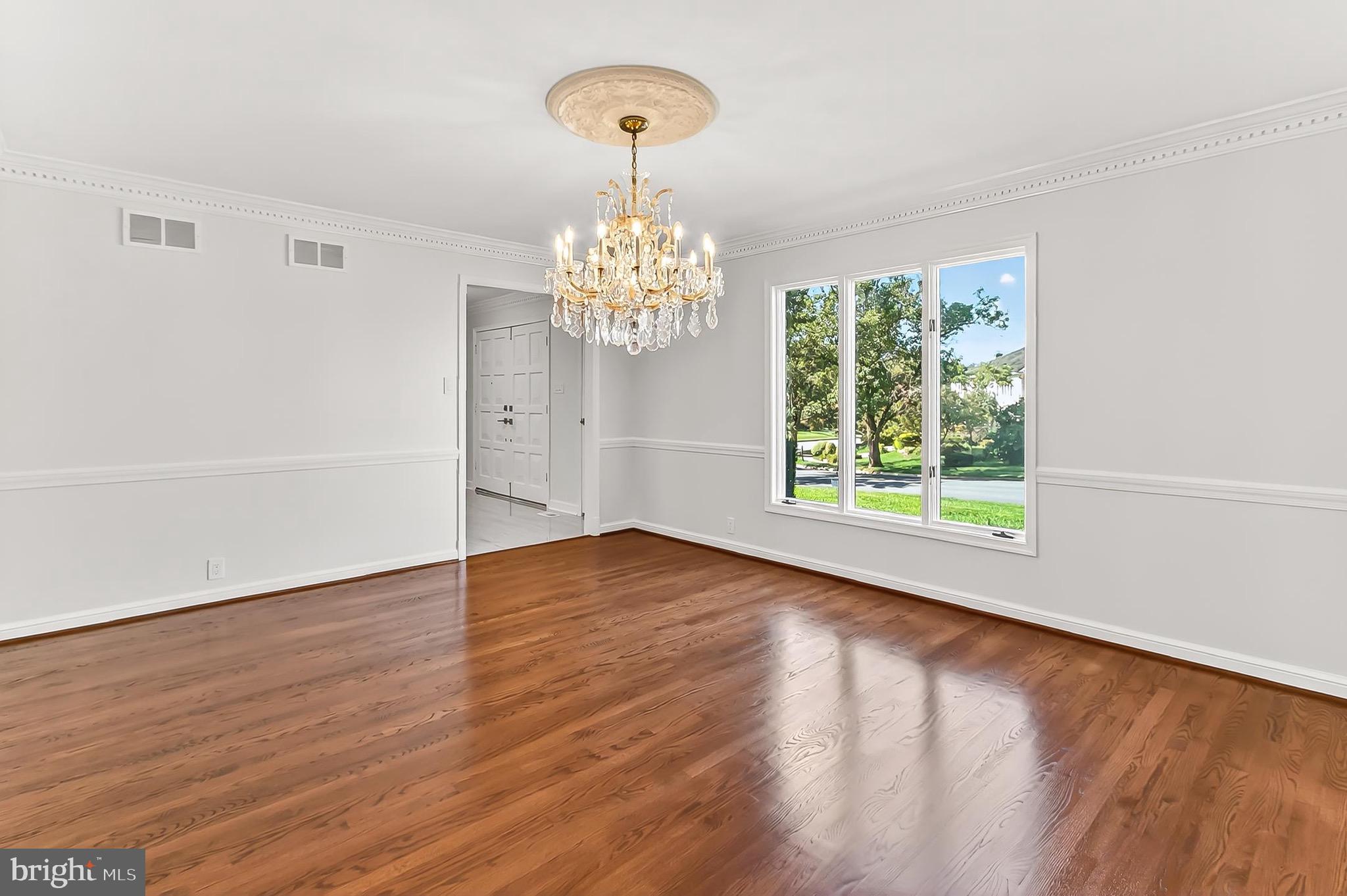 6294 Dunaway Court McLean, VA 22101 - Photo 14 of 76 a view of a room with wooden floor chandelier and a window