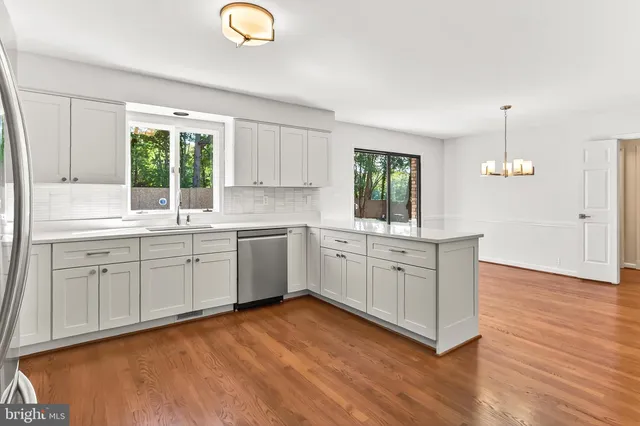 a living room with fireplace furniture and a flat screen tv