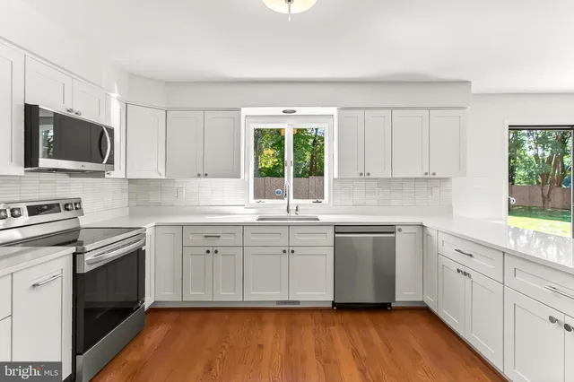 a spacious bedroom with a bed and a couch