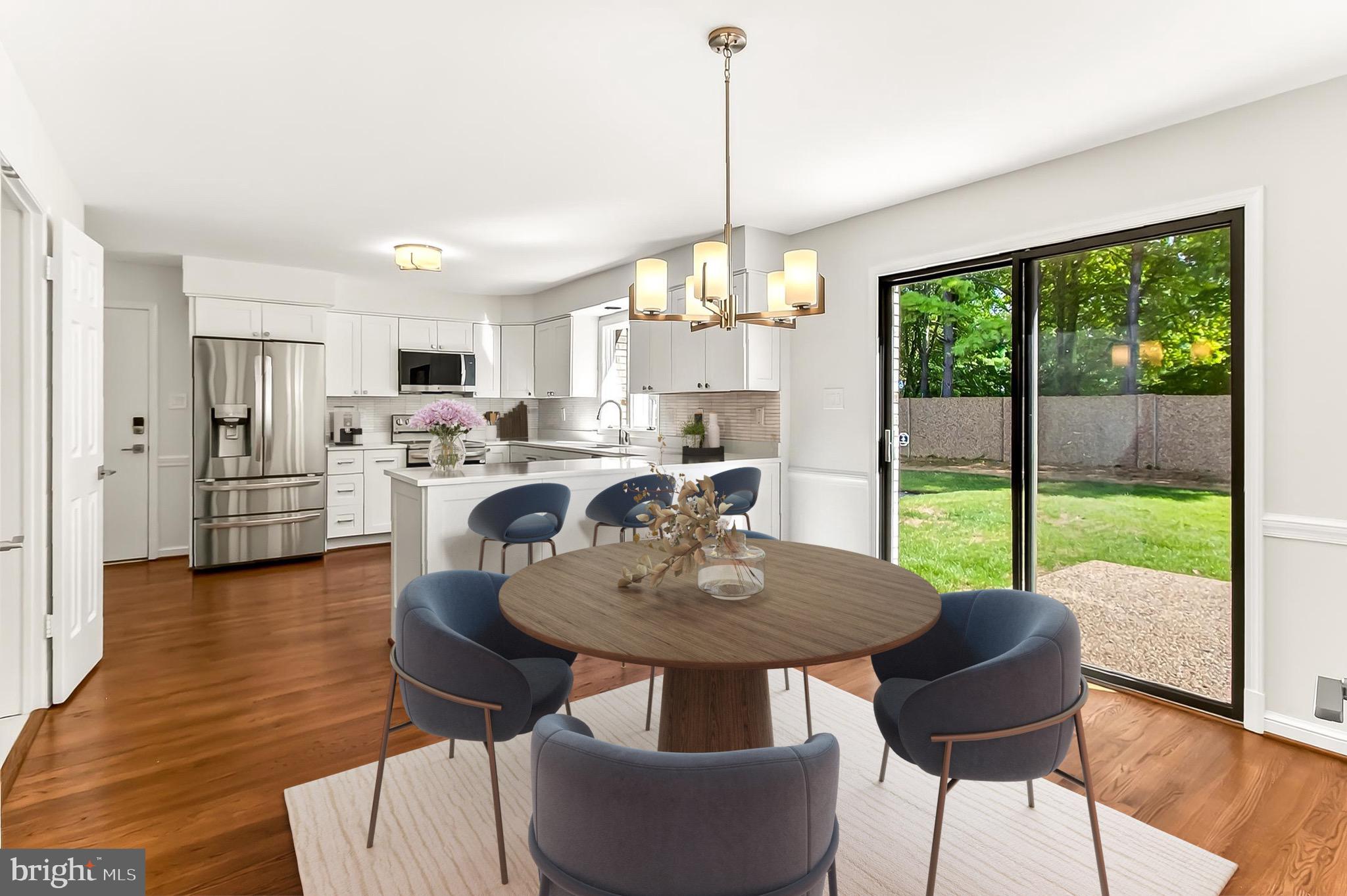 6294 Dunaway Court McLean, VA 22101 - Photo 21 of 76 a view of a dining room with furniture a chandelier and wooden floor