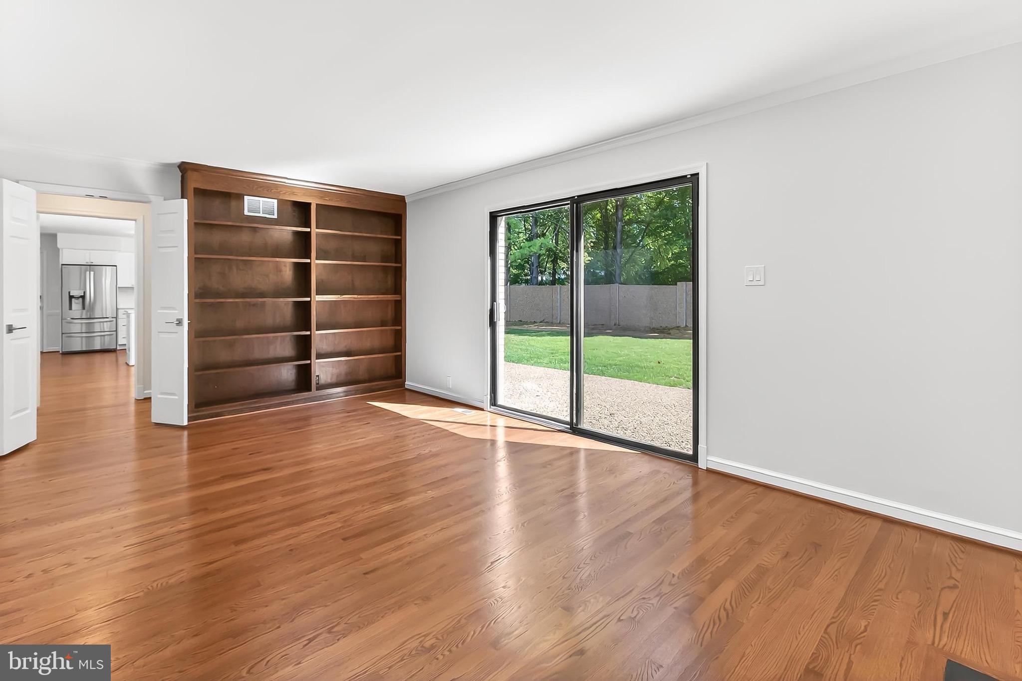 6294 Dunaway Court McLean, VA 22101 - Photo 26 of 76 wooden floor in an empty room with a wooden door