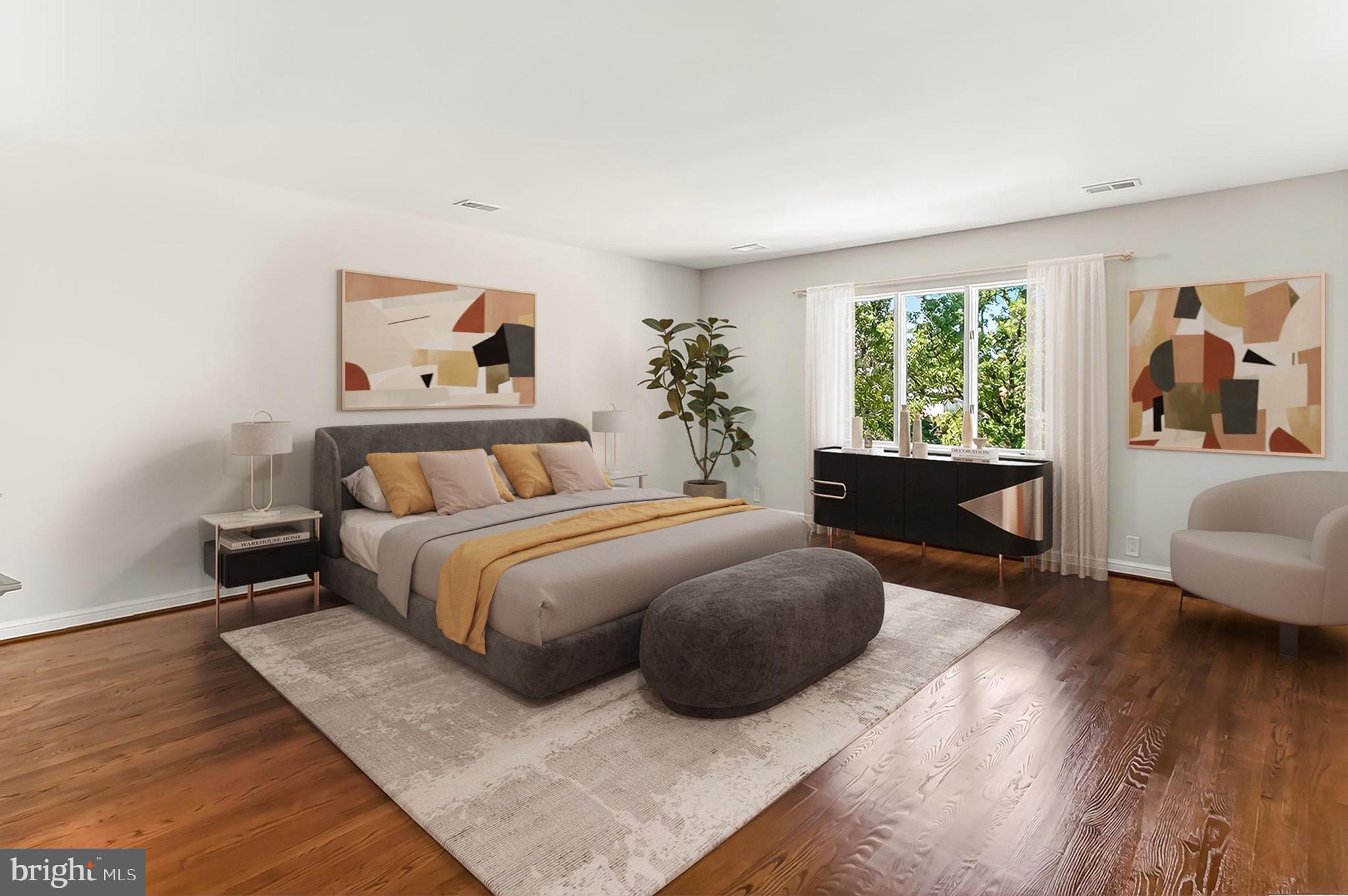 6294 Dunaway Court McLean, VA 22101 - Photo 30 of 76 a spacious bedroom with a bed and a couch