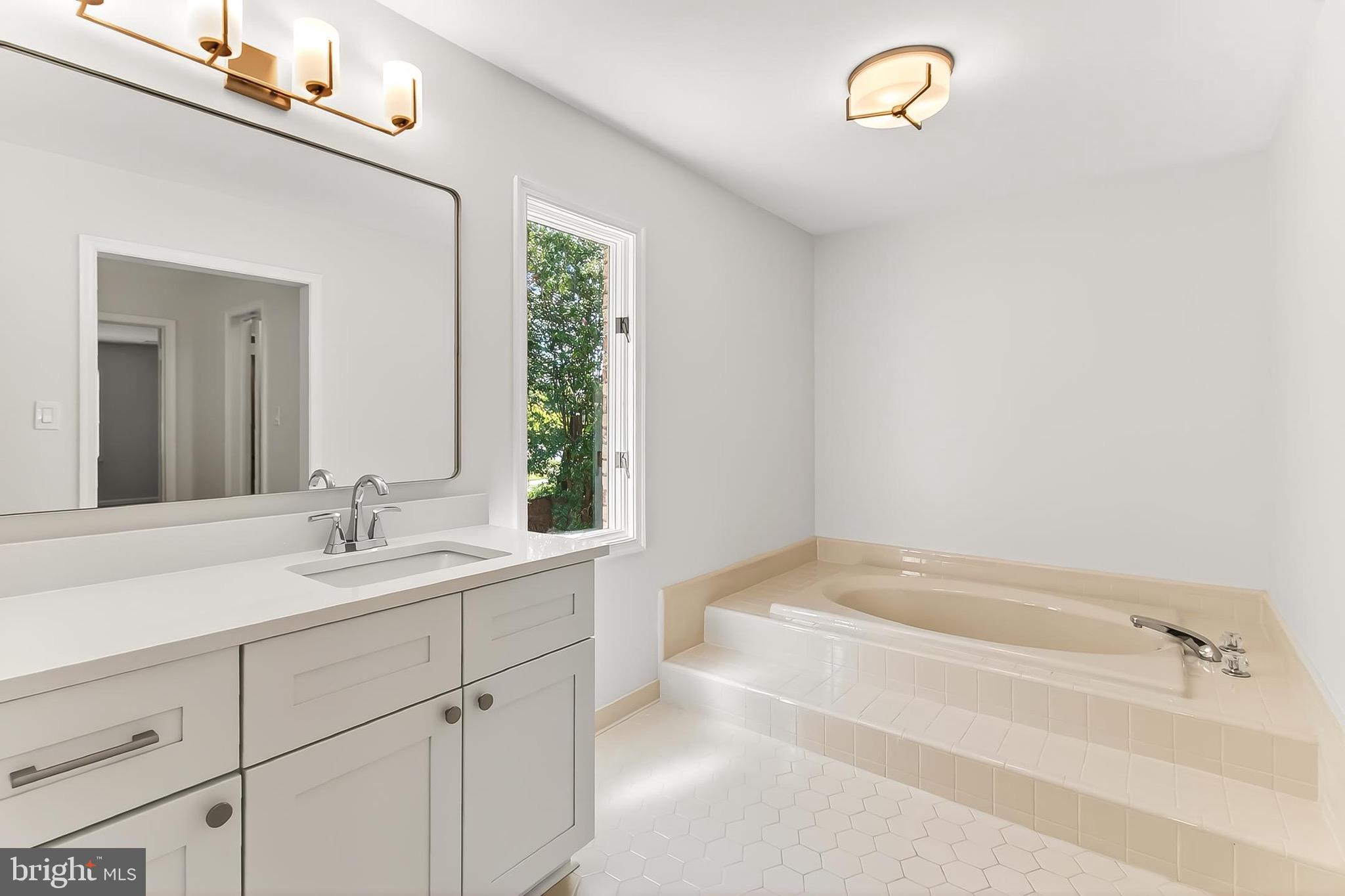 6294 Dunaway Court McLean, VA 22101 - Photo 35 of 76 a bathroom with a bathtub and a sink