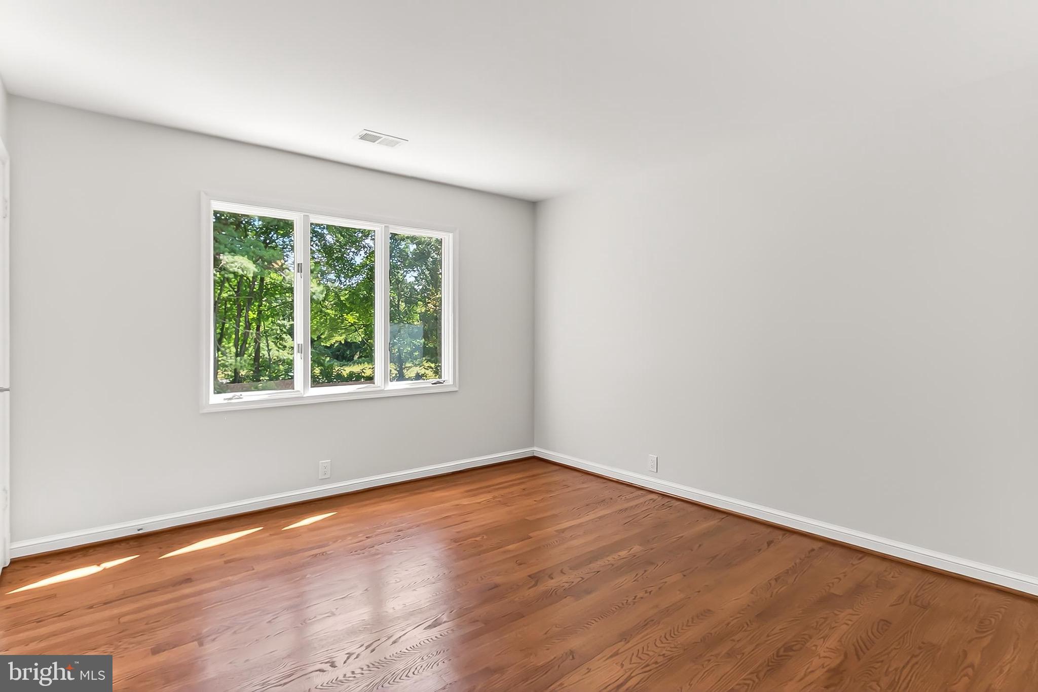 6294 Dunaway Court McLean, VA 22101 - Photo 39 of 76 an empty room with wooden floor and windows