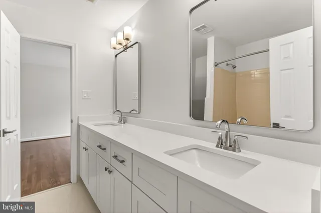 a bathroom with a toilet sink and shower