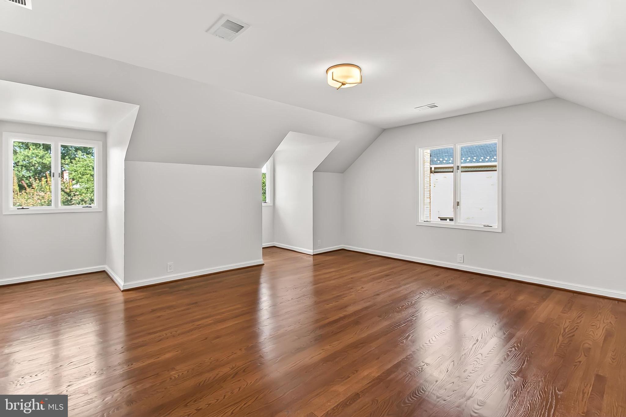 6294 Dunaway Court McLean, VA 22101 - Photo 44 of 76 an empty room with wooden floor and windows