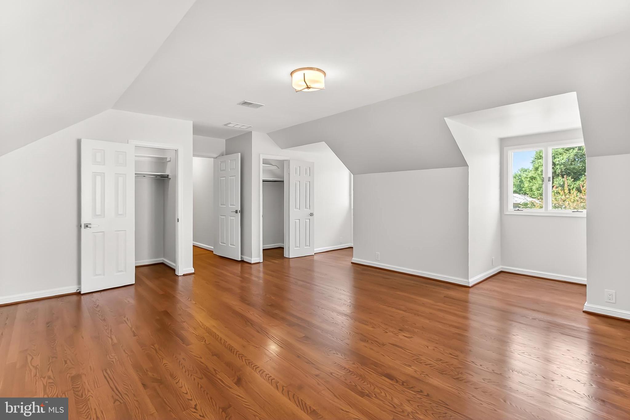6294 Dunaway Court McLean, VA 22101 - Photo 45 of 76 a view of an empty room with wooden floor and a window