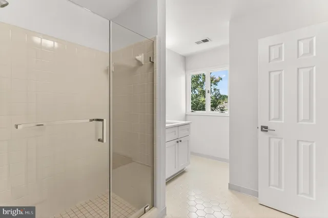 a view of yard with tree in front of it