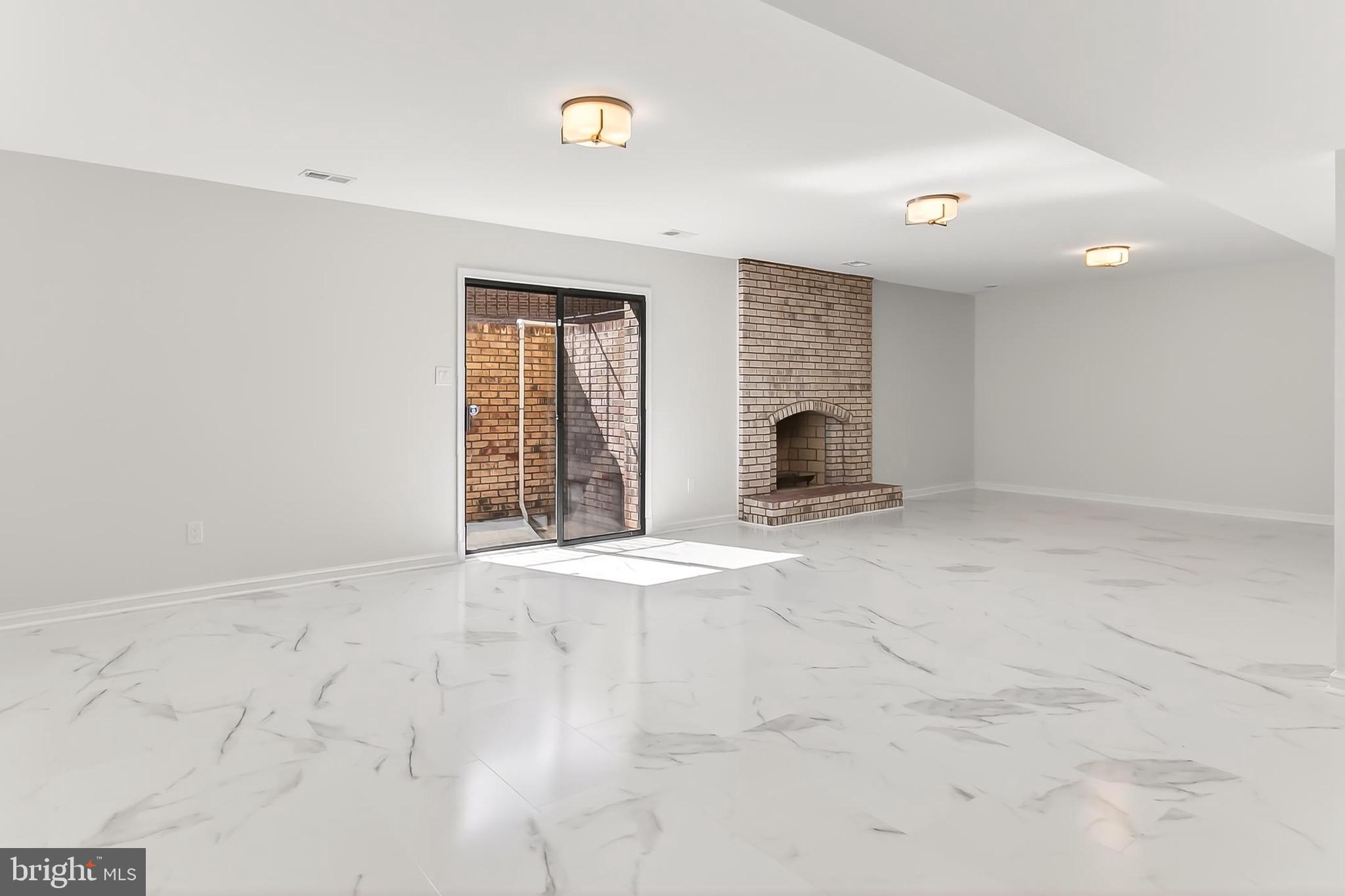 6294 Dunaway Court McLean, VA 22101 - Photo 56 of 76 an empty room with windows and fireplace