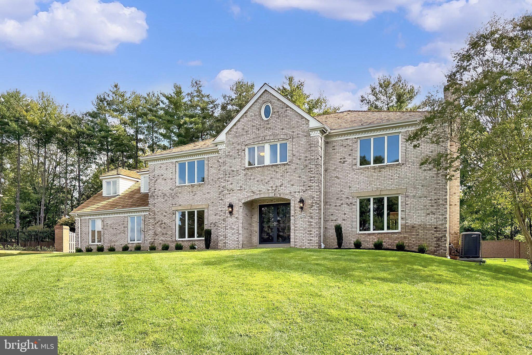 6294 Dunaway Court McLean, VA 22101 - Photo 75 of 76 a front view of a house with a garden and yard