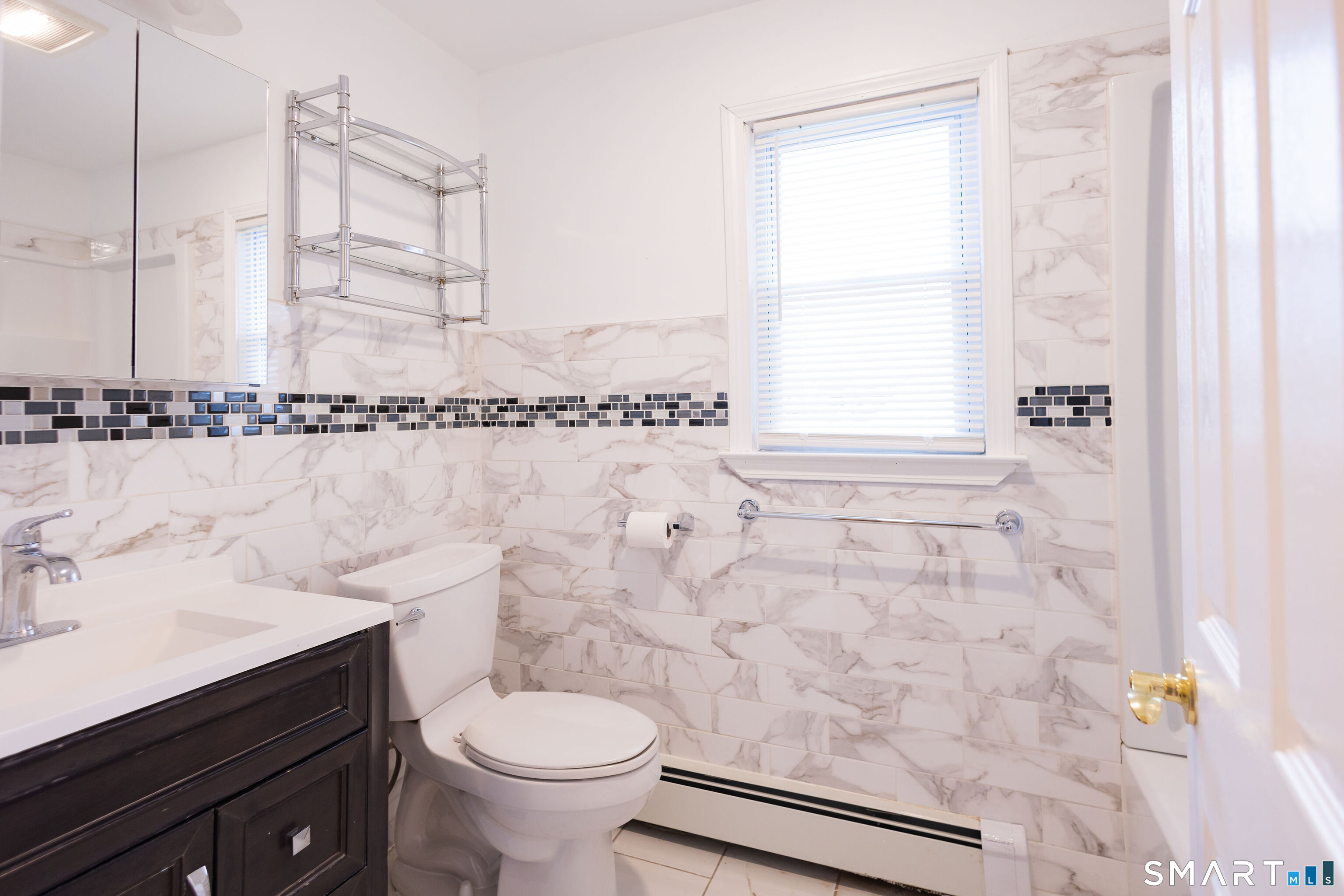 138 Infield Street Bridgeport, CT 06606 - Photo 15 of 34 a bathroom with a sink toilet and shower