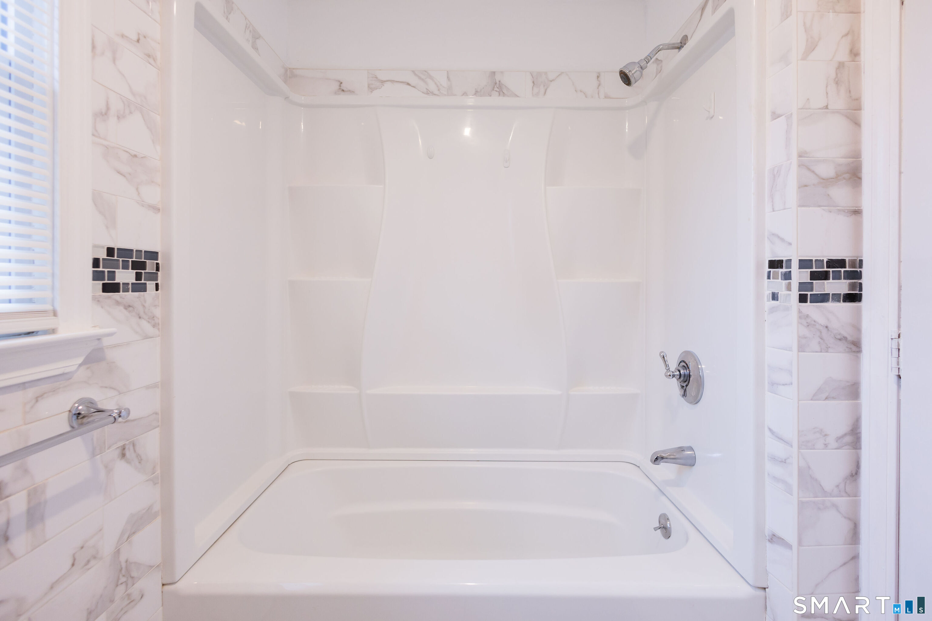 138 Infield Street Bridgeport, CT 06606 - Photo 16 of 34 a close view of a bathtub in a bathroom