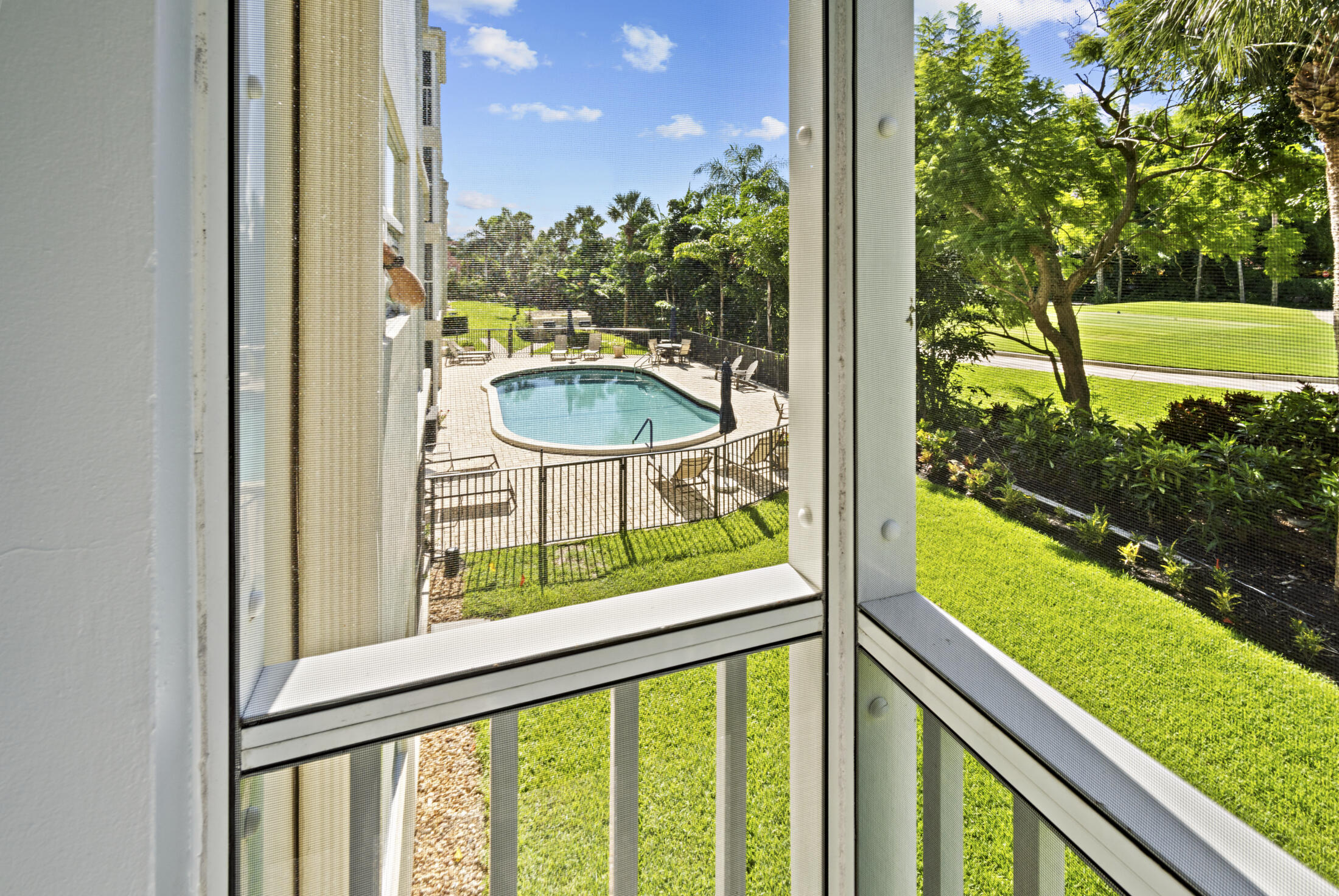 200 East Royal Palm Road, Unit 2110 Boca Raton, FL 33432 - Photo 7 of 36 View of Pool from Screened Patio