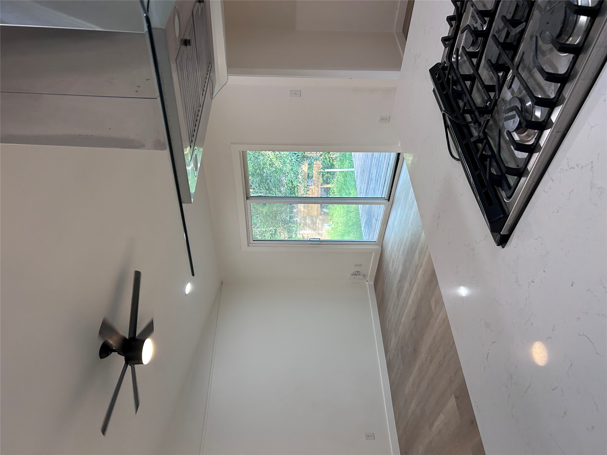 6603 Ripple Run Austin, TX 78744 - Photo 5 of 16 An open concept living area transitions effortlessly to an outdoor deck through sliding glass doors.