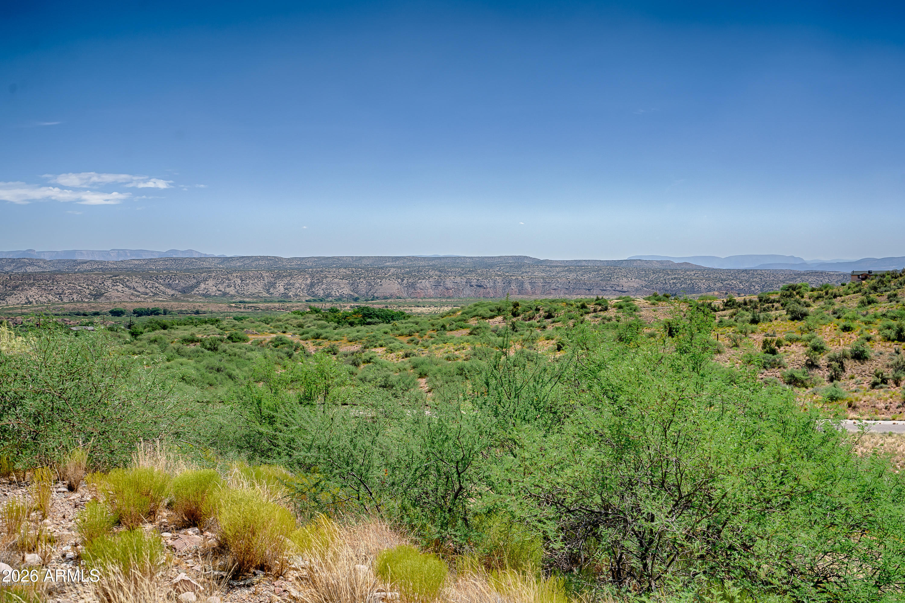 409 Powder Box Road, Unit 165 Clarkdale, AZ 86324 - Photo 3 of 10 a view of a garden with a lake