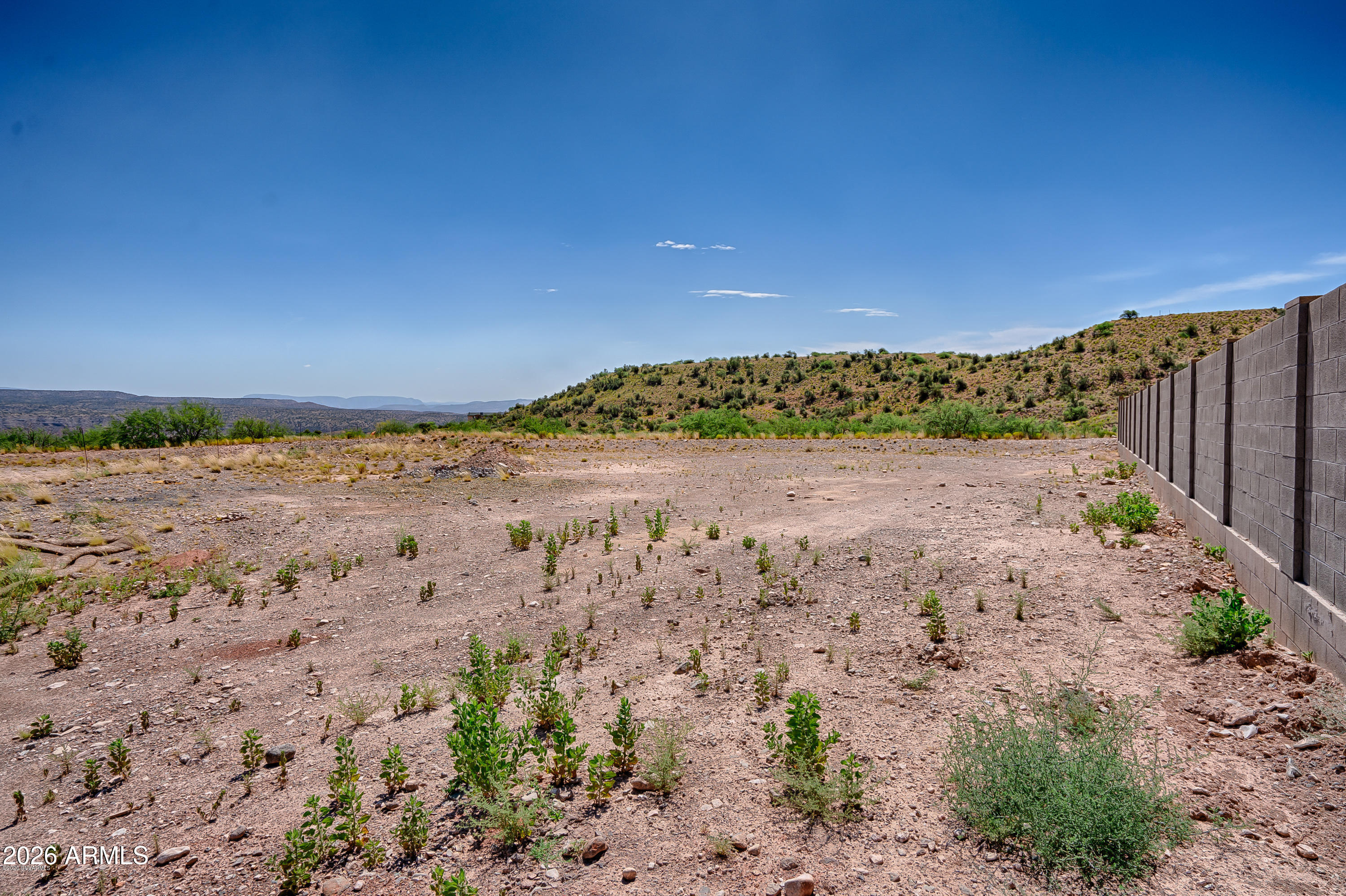 409 Powder Box Road, Unit 165 Clarkdale, AZ 86324 - Photo 6 of 10 a view of a road with a yard