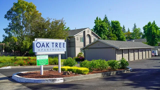 a sign that is sitting on a brick wall