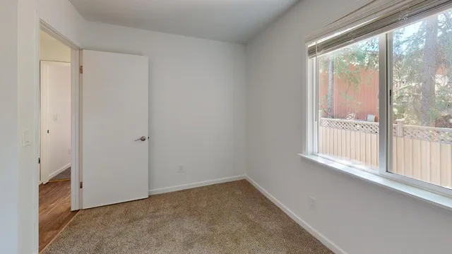 a view of an empty room with a window