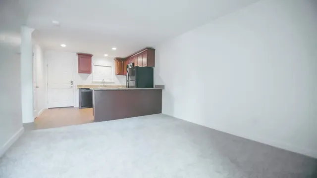 a view of kitchen and kitchen with sink